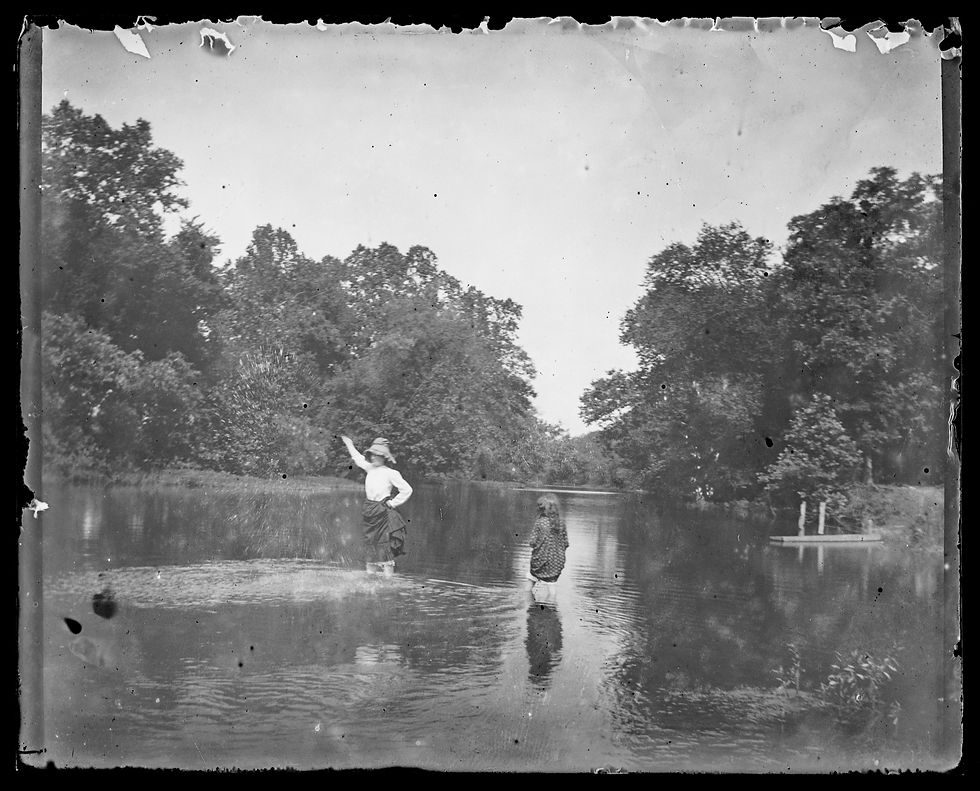 An unidentified woman and Geraldine Turner (right) beat the heat by wading in the shallows of the James River, ca. 1900. Image from the Turner Family Collection.