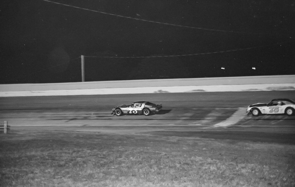 Dave Watson leads Larry Phillips in the 1976 Missouri State Asphalt Championship at the Fairgrounds Speedway in Springfield.