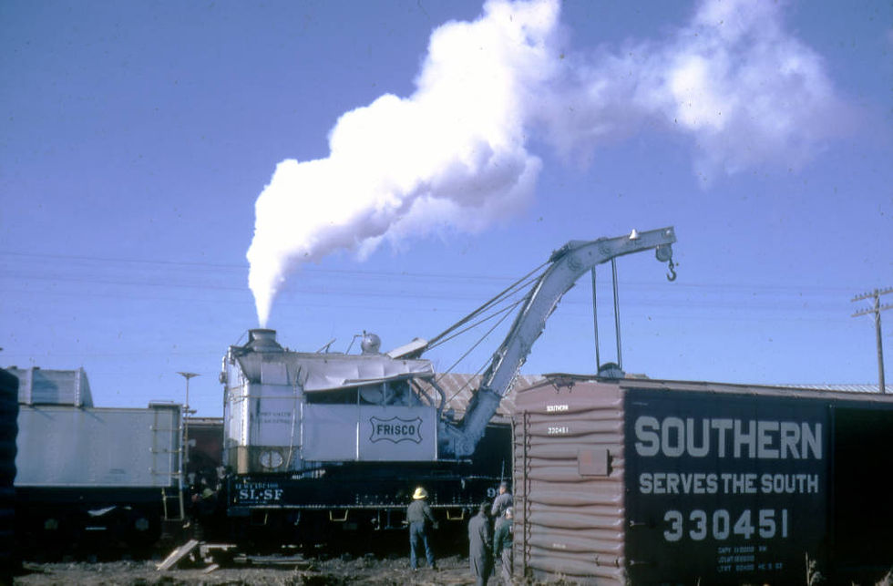 A photograph of a Frisco steam derrick in a railyard. 