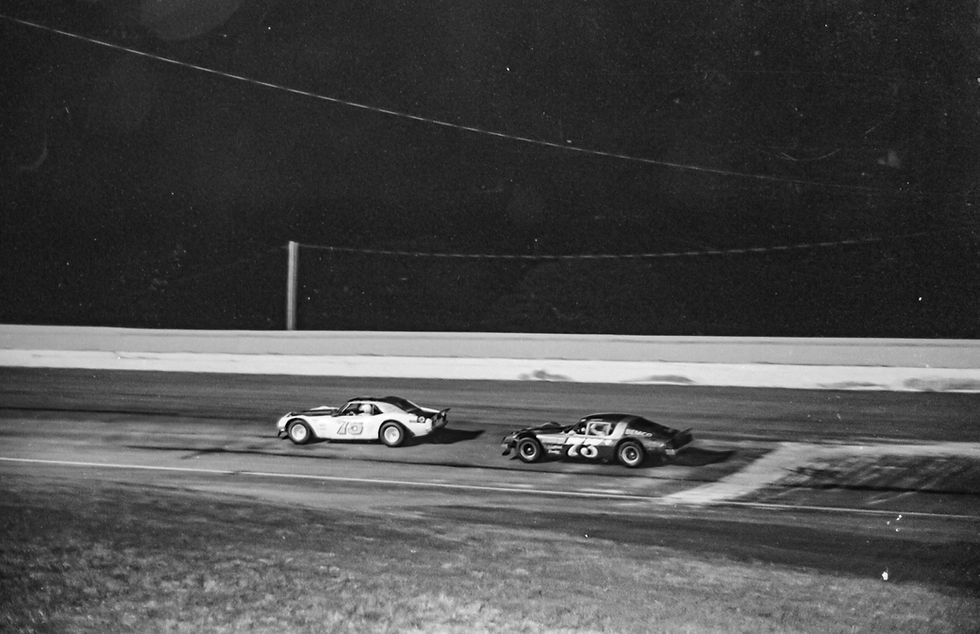 Larry Phillips pulls ahead of Dave Watson during the 1976 Missouri State Asphalt Championship at the Fairgrounds Speedway in Springfield.