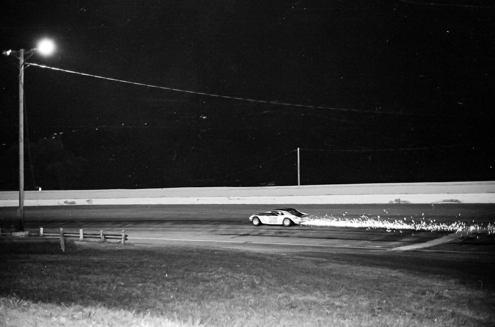 Sparks fly from Larry Phillips' car after he loses his rear right tire during the 1976 Missouri State Asphalt Championship at the Fairgrounds Speedway in Springfield.