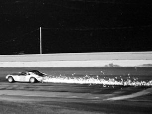 Racer Larry Phillips loses the lead in the 1976 Missouri State Asphalt Championship at the Fairgrounds Speedway in Springfield, Missouri when he loses his right rear wheel.