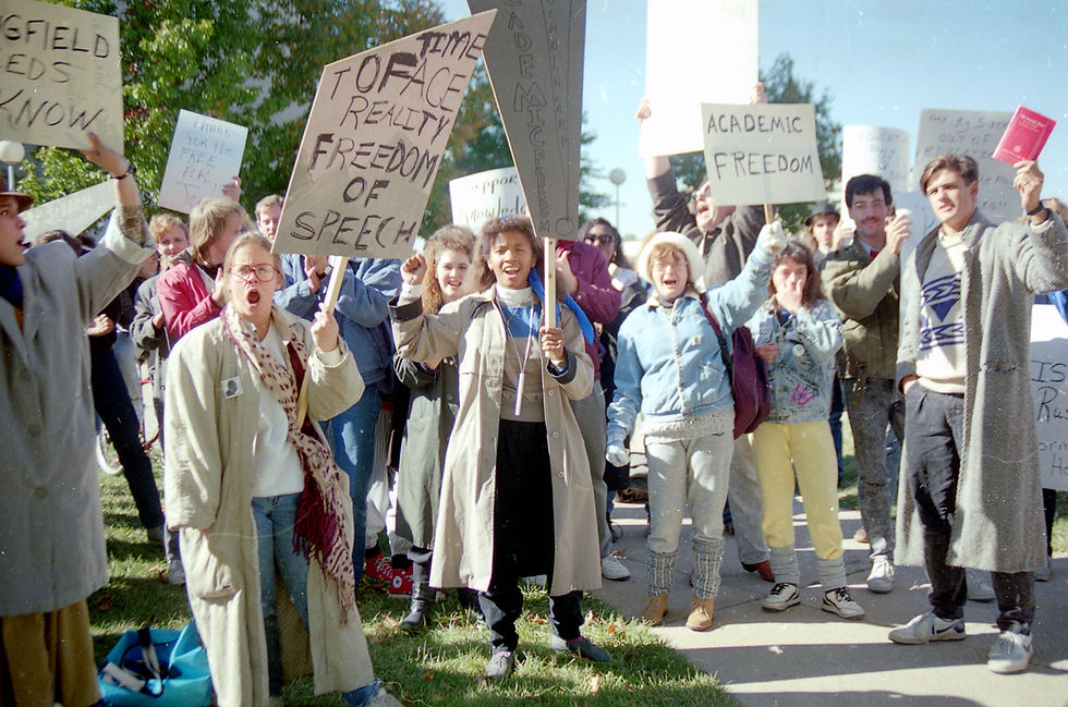 Students and other Springfield residents demonstrate in support of The Normal Heart. Signs read "Time to Face Reality Freedom of Speech" and "Academic Freedom."