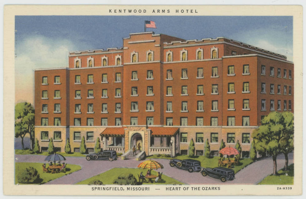 A postcard depicting the Kentwood Arms Hotel. The hotel has six stories and a orange-brown facade. Black cars are parked near the entrance.