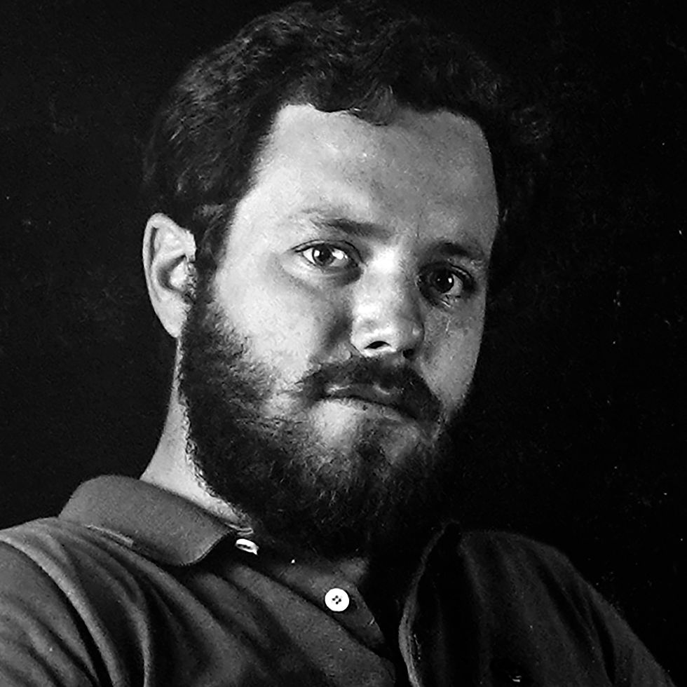 A black-and-white portrait of Tim Mullikin. 