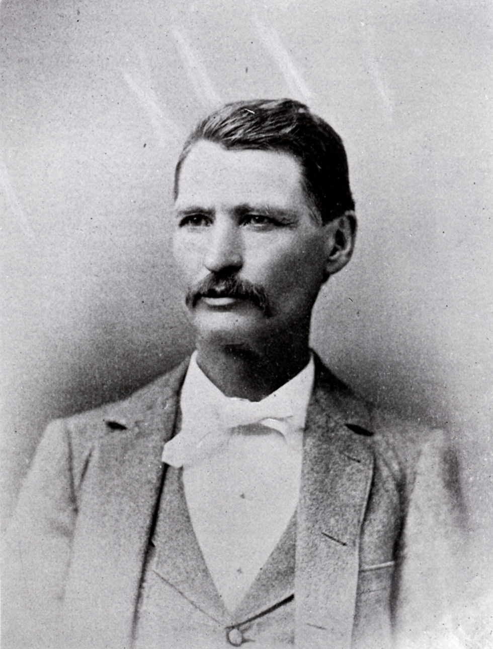 An undated portrait of D. C. Kennedy, owner of the Springfield Leader from 1869 to 1892. Kennedy has a mustache and is wearing a suit and bow tie.