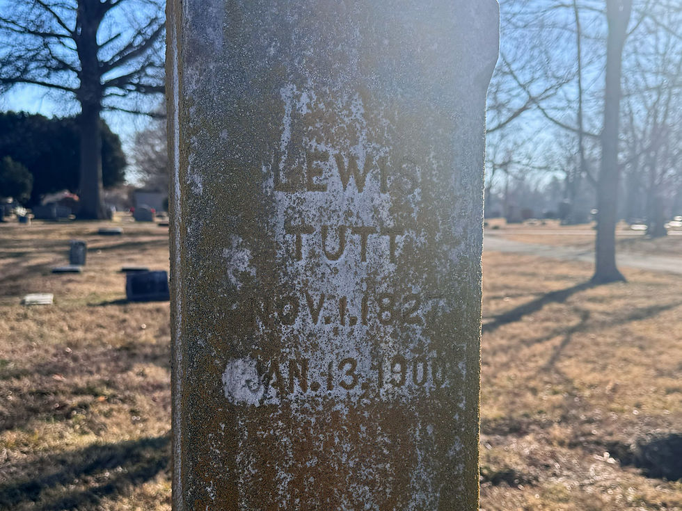 Lewis Tutt's gravestone at Maple Park Cemetery. The stone is covered in lichen. The inscription reads "Lewis Tutt. Nov. 1. 1827. Jan. 13. 1900."