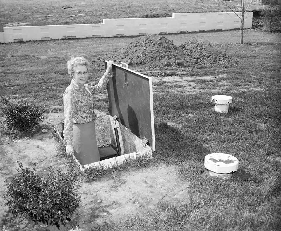 Udell Lawrence stands in her backyard shelter. Photograph by News & Leader staff.