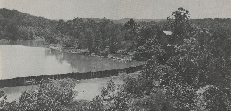 The mill and dam at Oasis, Missouri, on Long Creek, in 1926. The surrounding landscape is wooded and hilly.