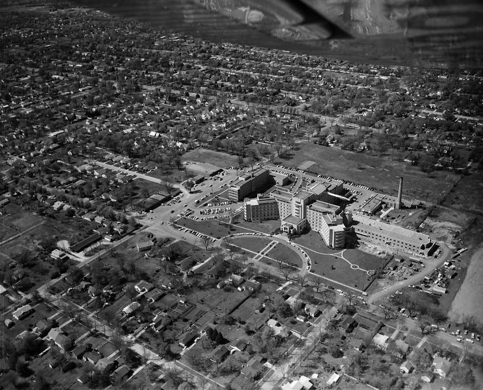 A black and white aerial photograph of St. John's Hospital and its surroundings, circa 1950.