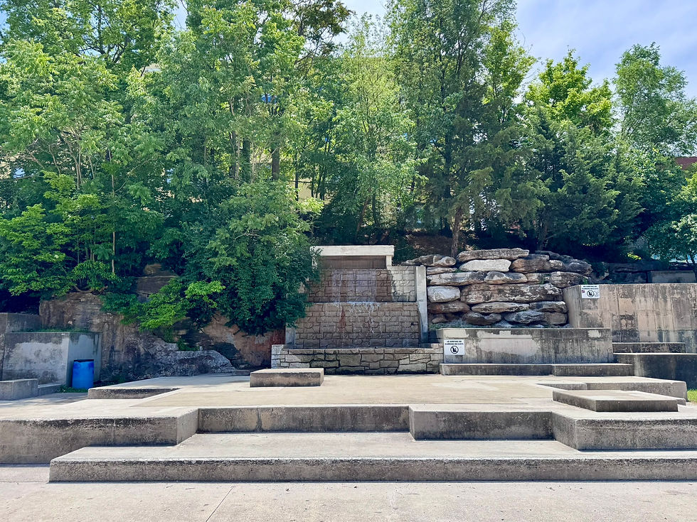 Limestone rocks next to a waterfall fountain in Founders Park