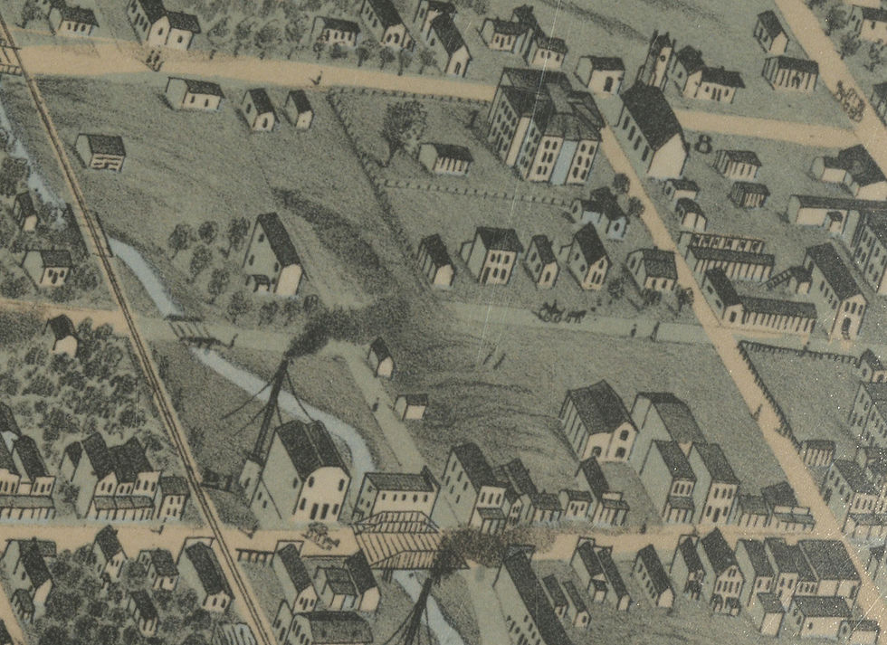 A close-up of what is now water street showing only a grass path and Jordan Creek