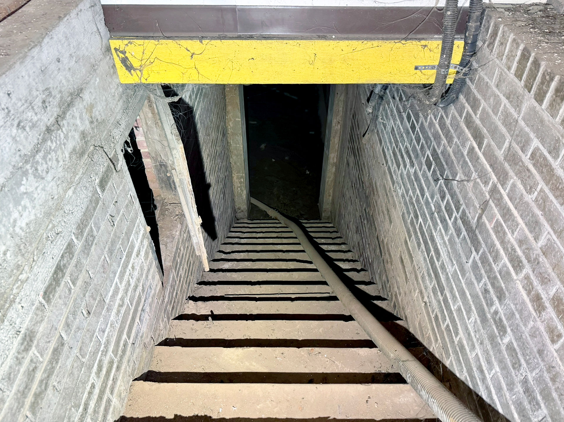 A staircase leads to the basement of National Audio Company