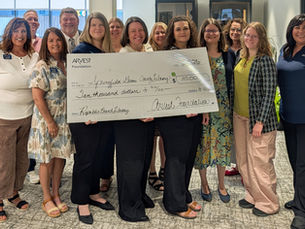 Arvest Bank and Library Employees display check