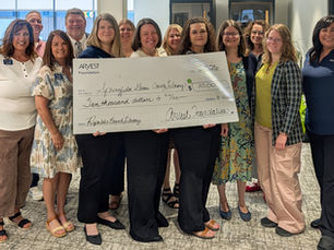 Arvest Bank and Library Employees display check