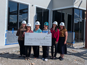 Arvest Reps and Library Staff with check