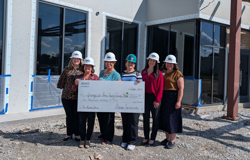 Arvest Reps and Library Staff with check